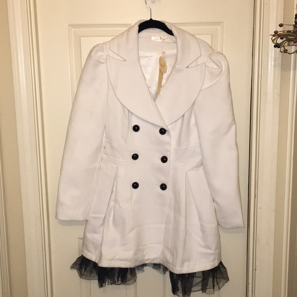 Juniors  trench coat with lace trim detail.